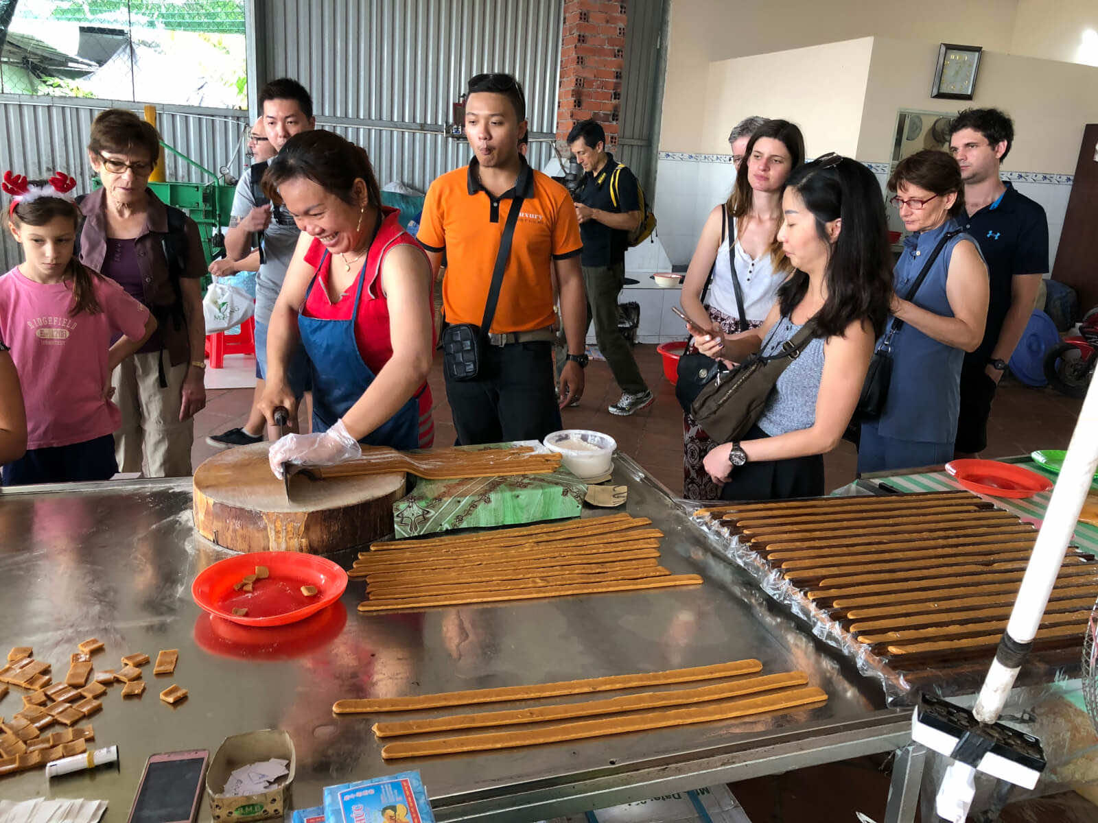 Pay a visit to coconut candy factory in Mekong Delta tour KIM TRAVEL